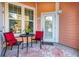 Relaxing patio with comfortable seating, a small table, and a decorative outdoor rug at 1615 Chatelain Way, Mount Pleasant, SC 29464