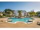 Beautiful community pool with ample seating and lush landscaping creates a relaxing oasis for residents to enjoy at 1615 Chatelain Way, Mount Pleasant, SC 29464