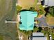 Aerial view of home with green roof, private dock, and waterway access at 1676 E Ashley Ave, Folly Beach, SC 29439