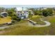 Aerial view showcasing the oceanfront beach homes with lovely landscaping and docks at 1676 E Ashley Ave, Folly Beach, SC 29439