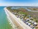 Beautiful aerial view of coastal homes along the beach with ocean views at 1676 E Ashley Ave, Folly Beach, SC 29439