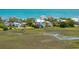 Backyard view of waterfront home showcasing waterfront views at 1676 E Ashley Ave, Folly Beach, SC 29439