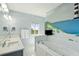 Bathroom showcasing tub, vanity, and themed art at 1676 E Ashley Ave, Folly Beach, SC 29439