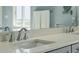 Close up on the bathroom vanity showing the light quartz countertop at 1676 E Ashley Ave, Folly Beach, SC 29439
