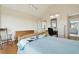 Spacious bedroom with natural light, hardwood floors, rocking chair, and work space at 1676 E Ashley Ave, Folly Beach, SC 29439