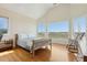 Bright bedroom with large windows, hardwood floors, and comfortable furnishings, offering scenic views at 1676 E Ashley Ave, Folly Beach, SC 29439
