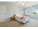 This bedroom features neutral carpet, two windows and a ceiling fan at 1676 E Ashley Ave, Folly Beach, SC 29439