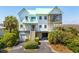 Beautiful two-story beach house with a screened porch, garage and landscaped yard at 1676 E Ashley Ave, Folly Beach, SC 29439
