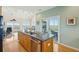 Open kitchen with hardwood floors, a center island, stainless steel appliances and views of the waterway at 1676 E Ashley Ave, Folly Beach, SC 29439