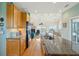 This kitchen features hardwood floors, granite countertops, modern appliances and a water view at 1676 E Ashley Ave, Folly Beach, SC 29439