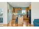 Bright eat-in kitchen with hardwood floors, a center island, stainless steel appliances and plenty of storage at 1676 E Ashley Ave, Folly Beach, SC 29439