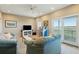 Comfortable living room featuring dual sofas, a jukebox, and an expansive view at 1676 E Ashley Ave, Folly Beach, SC 29439