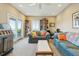 Relaxing living room featuring comfortable seating, a jukebox, and sliding doors with a view at 1676 E Ashley Ave, Folly Beach, SC 29439