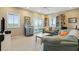 Cozy living room featuring plush sofas, bookcases, and sliding doors with a view at 1676 E Ashley Ave, Folly Beach, SC 29439