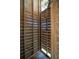 Rustic outdoor shower constructed with wood slats allowing sunlight to filter through at 1676 E Ashley Ave, Folly Beach, SC 29439