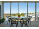 Screened-in porch features a table and seating with great views of the community at 1676 E Ashley Ave, Folly Beach, SC 29439