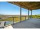 Wide porch with cable railing offers stunning panoramic views of the adjacent grassy marshland at 1676 E Ashley Ave, Folly Beach, SC 29439