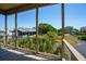 View of neighborhood houses from a covered wooden porch at 1676 E Ashley Ave, Folly Beach, SC 29439