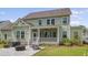 Green backyard featuring a patio with a grill and a lounge area, perfect for outdoor relaxation at 1755 Bolden Dr, Mount Pleasant, SC 29466
