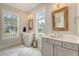 Luxurious bathroom featuring double vanities, marble countertops, and plenty of natural light for comfort and style at 1755 Bolden Dr, Mount Pleasant, SC 29466