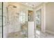 Modern bathroom featuring a glass-enclosed shower with marble tile, a bench, and upscale fixtures at 1755 Bolden Dr, Mount Pleasant, SC 29466