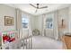 Charming Bedroom with two large windows, neutral walls, light-colored carpet, and crib at 1755 Bolden Dr, Mount Pleasant, SC 29466