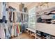 Walk-in closet featuring adjustable shelving, a window for natural light, and ample storage space at 1755 Bolden Dr, Mount Pleasant, SC 29466