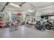 Organized garage with storage solutions, a golf cart, and a electric vehicle at 1755 Bolden Dr, Mount Pleasant, SC 29466