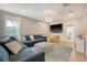 Cozy living room featuring a plush sectional, large TV, chandelier, and natural light at 1755 Bolden Dr, Mount Pleasant, SC 29466