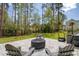Outdoor patio with a fire pit, lounge chairs, and well-maintained landscaping for relaxing and entertaining at 1755 Bolden Dr, Mount Pleasant, SC 29466