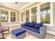 Relaxing outdoor space with comfortable wicker sofa, ottoman, and chairs on a wooden porch at 1755 Bolden Dr, Mount Pleasant, SC 29466