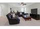 Spacious basement with comfortable seating, a large TV, and a ceiling fan at 1907 Mossdale Dr, Johns Island, SC 29455