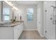 Bathroom with double vanity, granite countertops, and glass-enclosed shower at 1907 Mossdale Dr, Johns Island, SC 29455
