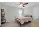 Bedroom featuring neutral tones, a ceiling fan, and a decorative display shelf at 1907 Mossdale Dr, Johns Island, SC 29455