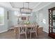 Stylish dining room with natural light, a rustic table, and modern decor for elegant dining at 1907 Mossdale Dr, Johns Island, SC 29455