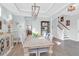 Airy dining area features modern lighting, light wood flooring and neutral colored decor at 1907 Mossdale Dr, Johns Island, SC 29455