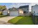 Two-story home with a concrete driveway, a well-manicured lawn and garage at 1907 Mossdale Dr, Johns Island, SC 29455