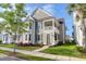 Charming two-story home features a covered porch, well-manicured lawn, and beautiful landscaping at 1907 Mossdale Dr, Johns Island, SC 29455