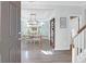 Warm and inviting foyer with hardwood floors, elegant lighting, and a view of the dining room at 1907 Mossdale Dr, Johns Island, SC 29455