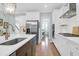 Modern kitchen featuring stainless steel appliances, white cabinets, and a center island at 1907 Mossdale Dr, Johns Island, SC 29455