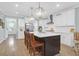 Spacious kitchen with white cabinets, stainless steel appliances, and a large island with bar seating at 1907 Mossdale Dr, Johns Island, SC 29455