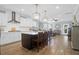Open-concept kitchen flows into living space with large island, seating, and ample natural light at 1907 Mossdale Dr, Johns Island, SC 29455
