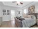 Serene bedroom with tray ceiling, ceiling fan, and ensuite bathroom access at 1907 Mossdale Dr, Johns Island, SC 29455