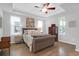 Cozy bedroom with neutral tones, a ceiling fan, and ample natural light at 1907 Mossdale Dr, Johns Island, SC 29455
