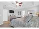 Comfortable bedroom with tray ceiling, ceiling fan, and a dresser at 1907 Mossdale Dr, Johns Island, SC 29455