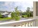 Neighborhood view from a porch, showcasing well-maintained lawns and charming homes at 1907 Mossdale Dr, Johns Island, SC 29455