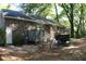 Brick house with outdoor seating area, showcasing a cozy backyard setting at 20 Anderson Ave, Charleston, SC 29412