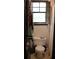 Cozy bathroom featuring a toilet under a window with natural light at 20 Anderson Ave, Charleston, SC 29412