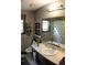 The bathroom features a shower/tub combo, a single sink vanity, and natural light with bamboo shades at 20 Anderson Ave, Charleston, SC 29412