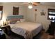 Comfortable bedroom with ceiling fan, wall decor, a bed, and natural light from the windows at 20 Anderson Ave, Charleston, SC 29412